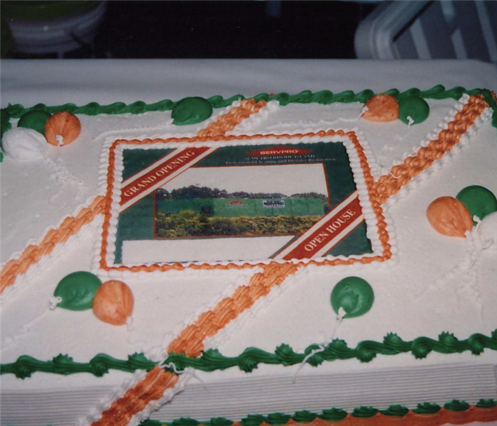 a cake that says grand opening